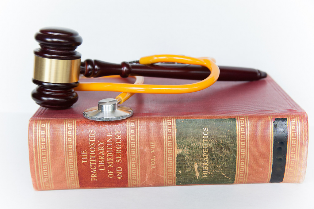 gavel, stethoscope on book